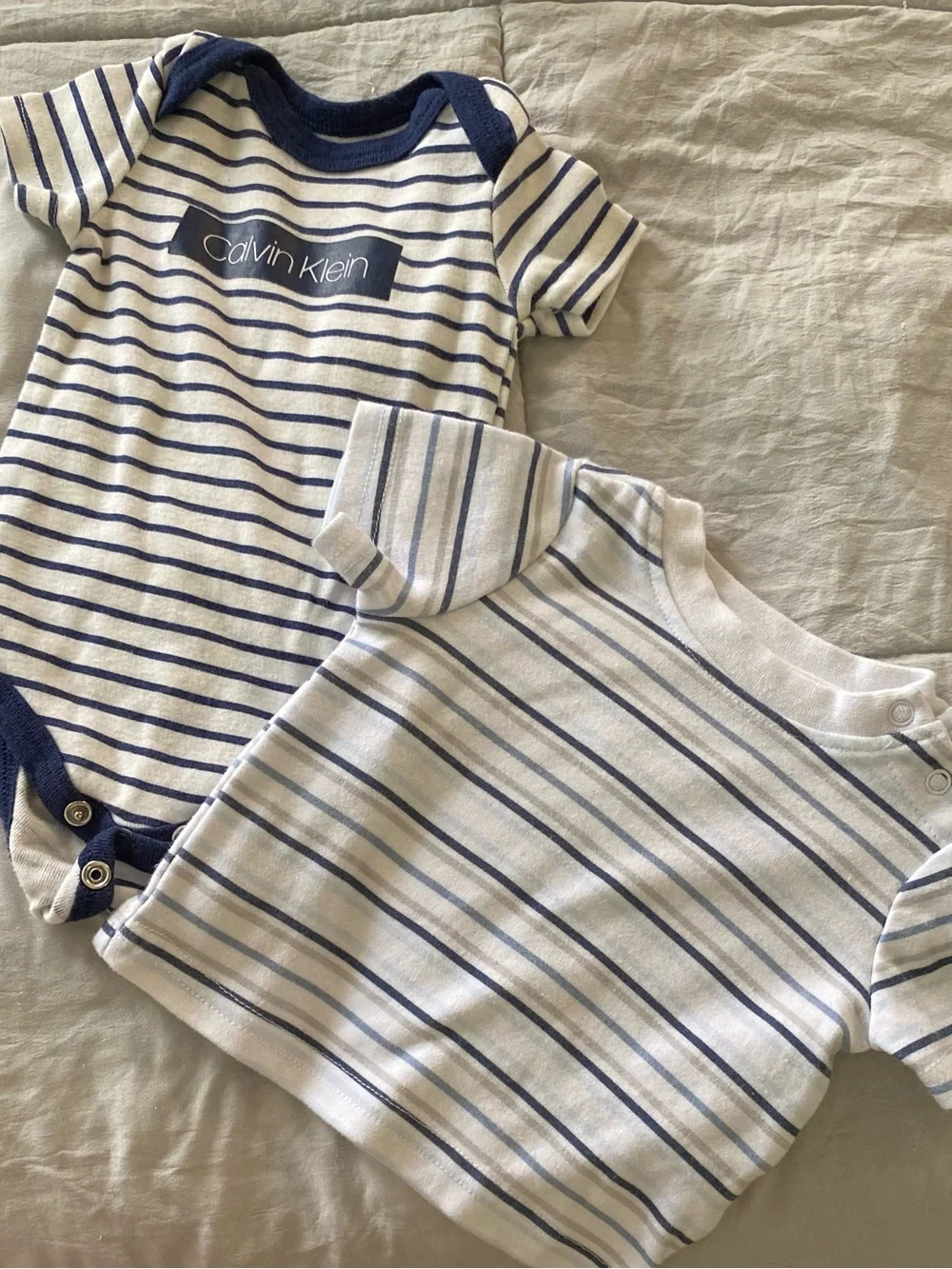 Calvin Klein Navy & White Striped Baby Onesie with Mixed Neutral Baby Clothing